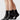 Swedish Stockings Billy svarta ankelstrumpor på två par ben, för att förstärka att det säljs i 2-pack, strumporna är i veganskt material och har en ribbad textur och en bred mudd.