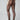Ett par ben som bär veganska svarta strumpbyxor från Swedish Stockings, 20 denier. Sedd bakifrån.