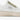Detaljbild på MoEa GEN 1 Cactus White & Aloe veganska sneakers i en kombination av vitt och grönt. Fokuserad på sidan av skon där det finns en svart text med 
MoEa´s inspirerande tankesätt.